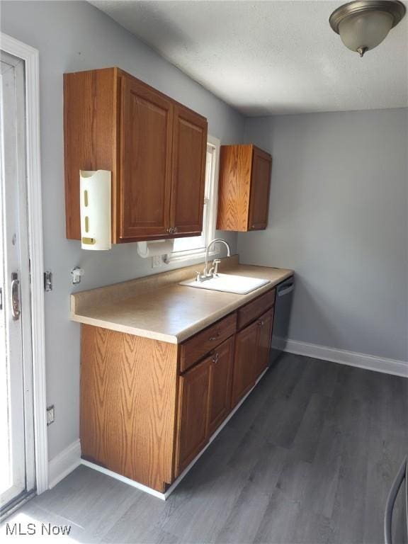13112 Shady Oak Blvd, Garfield Heights, OH 44125 - kitchen featuring dark wood finished floors, dishwasher, brown cabinets, and light countertops