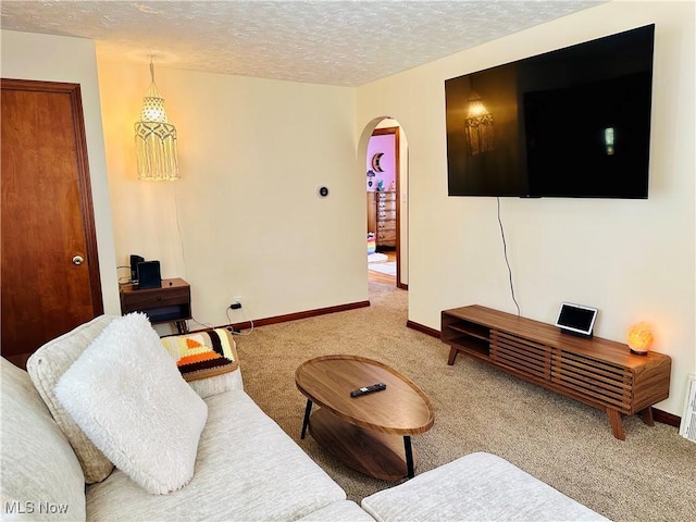 788 E Archwood Ave, Akron, OH 44306 - carpeted living area with arched walkways and a textured ceiling