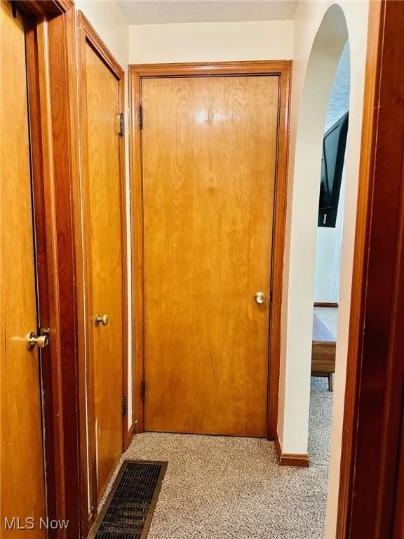 788 E Archwood Ave, Akron, OH 44306 - hallway with carpet flooring and arched walkways