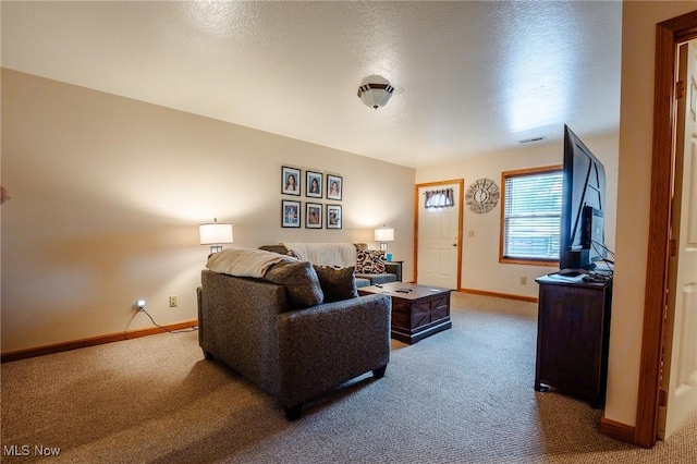 412 SW Weber Ave, Strasburg, OH 44680 - carpeted living room featuring baseboards and a textured ceiling