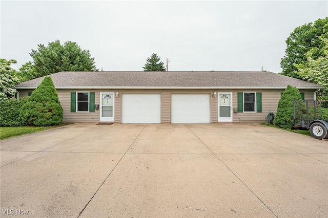 412 SW Weber Ave, Strasburg, OH 44680 - ranch-style home with a garage, driveway, and a shingled roof