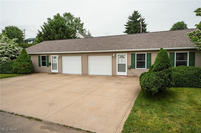 412 SW Weber Ave, Strasburg, OH 44680 - ranch-style home with a garage, concrete driveway, a front yard, and a shingled roof