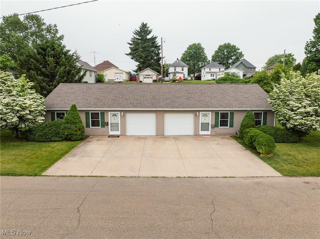 412 SW Weber Ave, Strasburg, OH 44680 - view of front of home with a garage, a front yard, concrete driveway, and a residential view