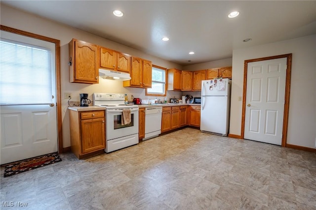 412 SW Weber Ave, Strasburg, OH 44680 - kitchen with white appliances, under cabinet range hood, light countertops, recessed lighting, and brown cabinetry
