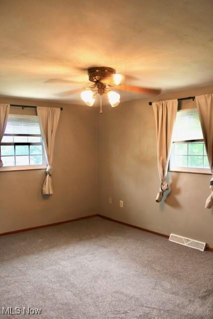 188 Court St, Follansbee, WV 26037 - carpeted empty room with healthy amount of natural light and ceiling fan