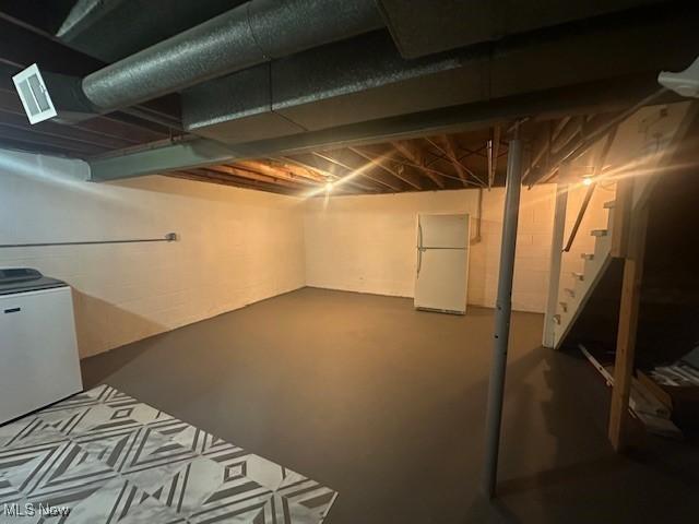 188 Court St, Follansbee, WV 26037 - unfinished basement with freestanding refrigerator, fridge, and stairway