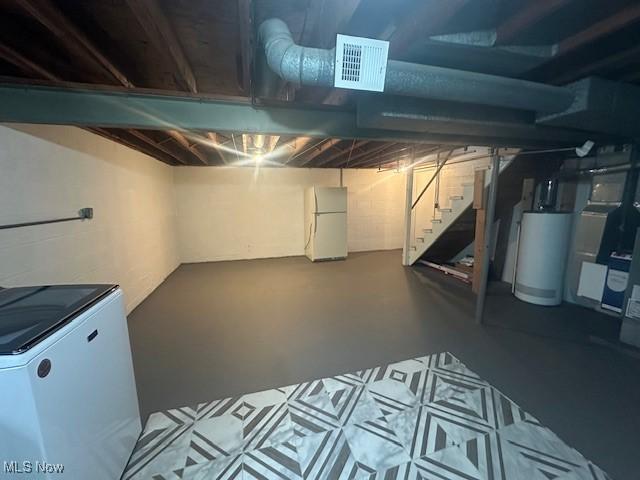 188 Court St, Follansbee, WV 26037 - unfinished below grade area with freestanding refrigerator, water heater, fridge, stairs, and heating unit