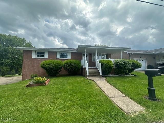 188 Court St, Follansbee, WV 26037 - single story home featuring a front lawn, a porch, and brick siding