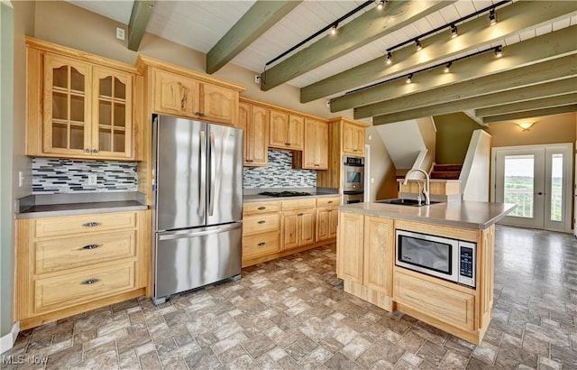 85551 Beagle Club Rd, Scio, OH 43988 - kitchen with appliances with stainless steel finishes, light brown cabinets, backsplash, glass insert cabinets, and stone finish floors