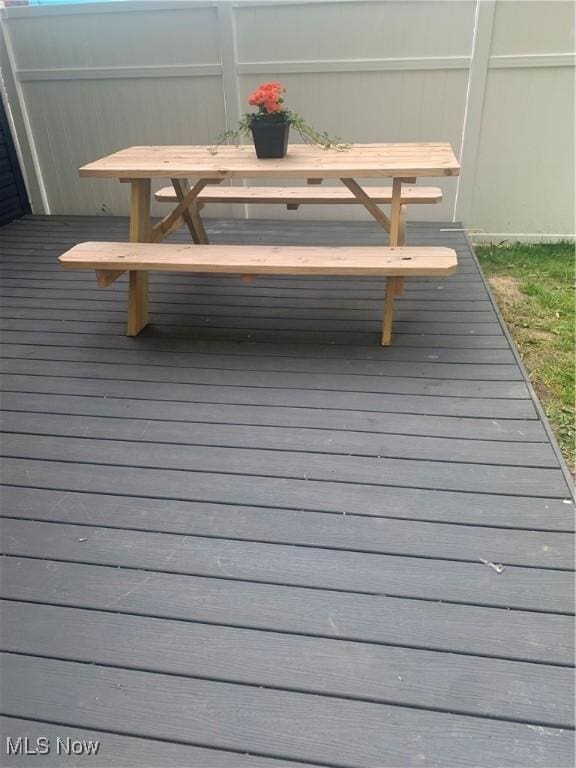 982 Day St, Conneaut, OH 44030 - wooden deck with outdoor dining area