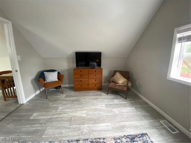 982 Day St, Conneaut, OH 44030 - sitting room with lofted ceiling and light wood finished floors