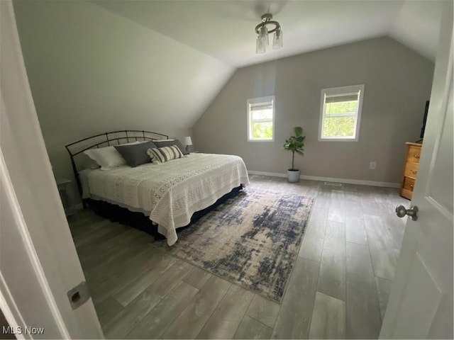 982 Day St, Conneaut, OH 44030 - bedroom with lofted ceiling and wood finished floors