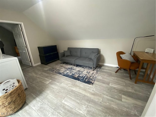 982 Day St, Conneaut, OH 44030 - living area featuring lofted ceiling, wood finished floors, and washer / dryer