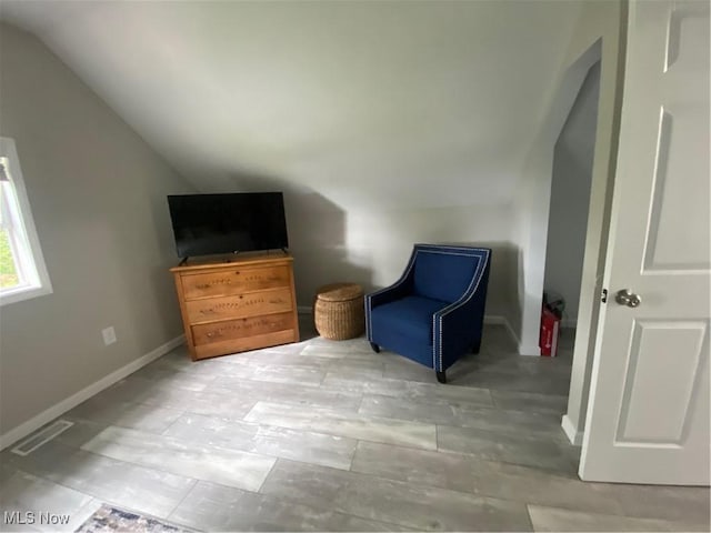982 Day St, Conneaut, OH 44030 - sitting room with vaulted ceiling and baseboards