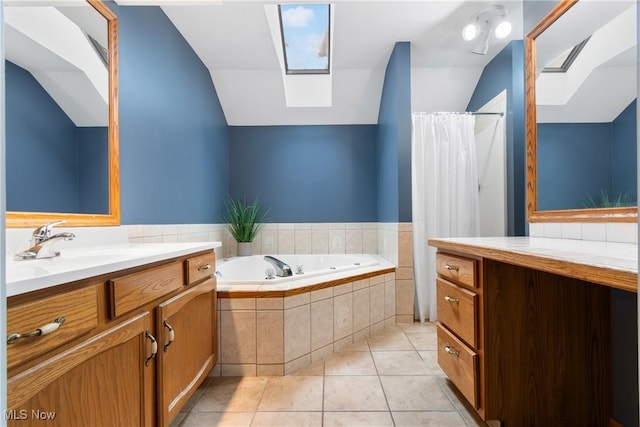 11095 Jan Cir NW, Uniontown, OH 44685 - full bathroom with vaulted ceiling, a skylight, vanity, a tub with jets, and tile patterned floors