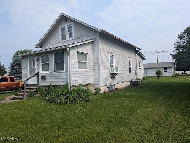 143 2nd St SE, Strasburg, OH 44680 - view of property exterior with a yard and entry steps