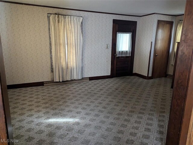143 2nd St SE, Strasburg, OH 44680 - carpeted spare room with ornamental molding and wallpapered walls