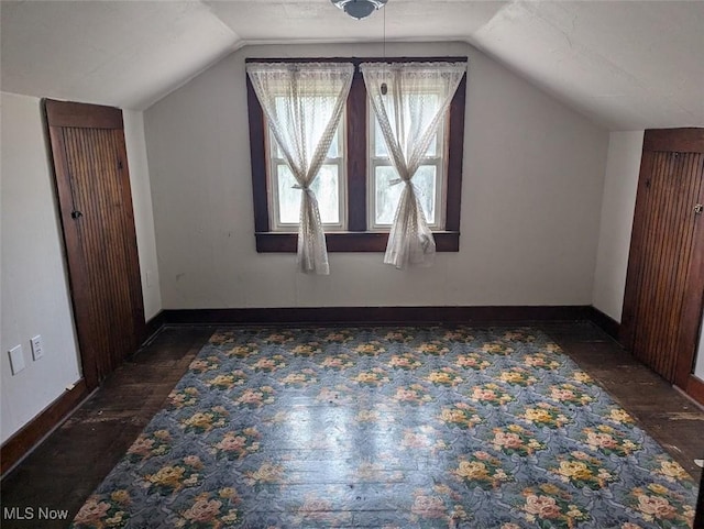 143 2nd St SE, Strasburg, OH 44680 - additional living space with lofted ceiling and wood finished floors
