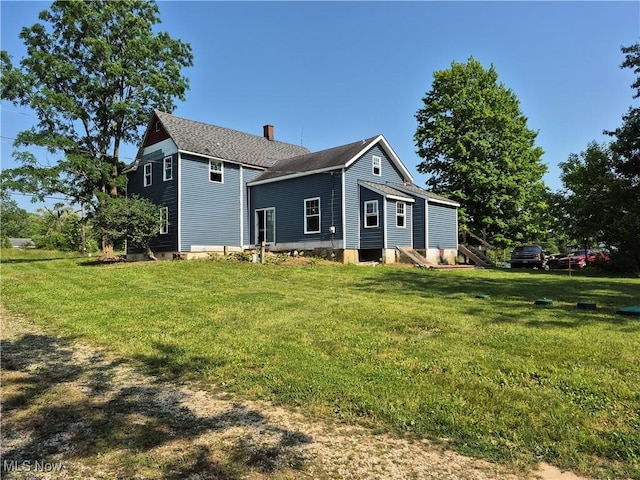 7810 Avon Lake Rd, Lodi, OH 44254 - view of front of house with a front lawn and a chimney
