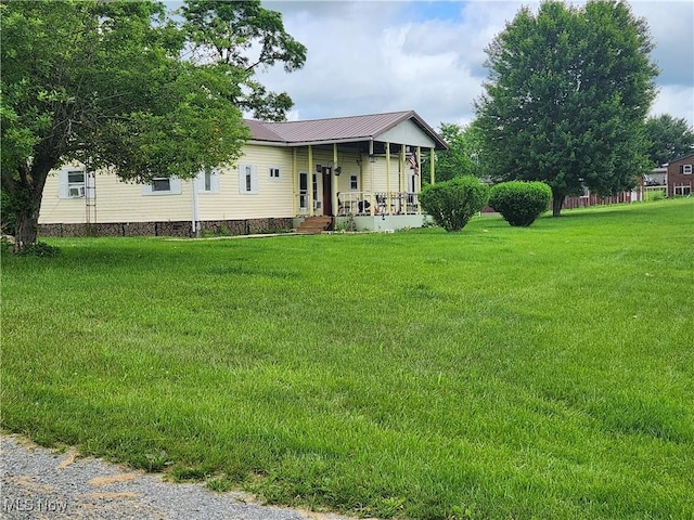 751 State Route 83, Beverly, OH 43728 - view of front of property with a porch, a front lawn, and a metal roof