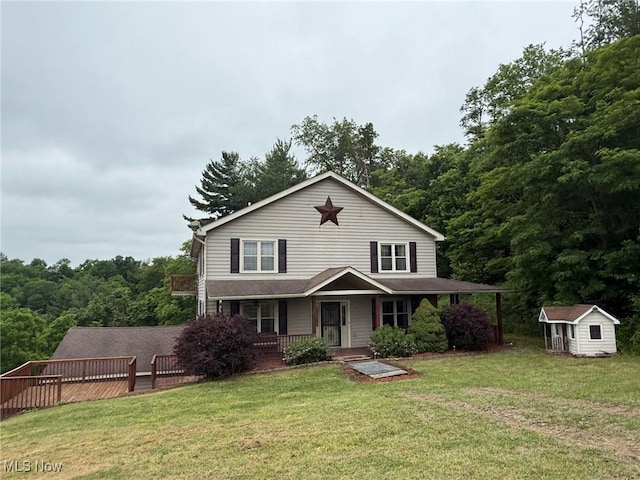 2484 Township Road 262, Bergholz, OH 43908 - view of front of property featuring a porch, a front lawn, and a storage unit