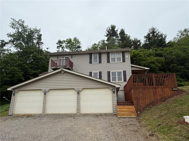 2484 Township Road 262, Bergholz, OH 43908 - view of front of house featuring a garage, a deck, and stairs