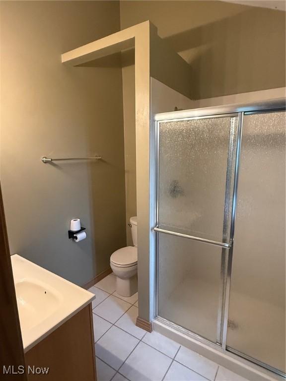 2484 Township Road 262, Bergholz, OH 43908 - full bath featuring a shower stall, vanity, and tile patterned flooring