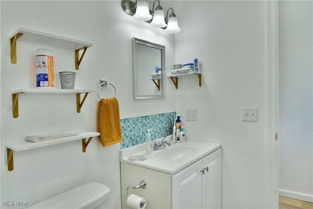 1774 Edgewood St NE, Warren, OH 44483 - bathroom featuring vanity and tasteful backsplash