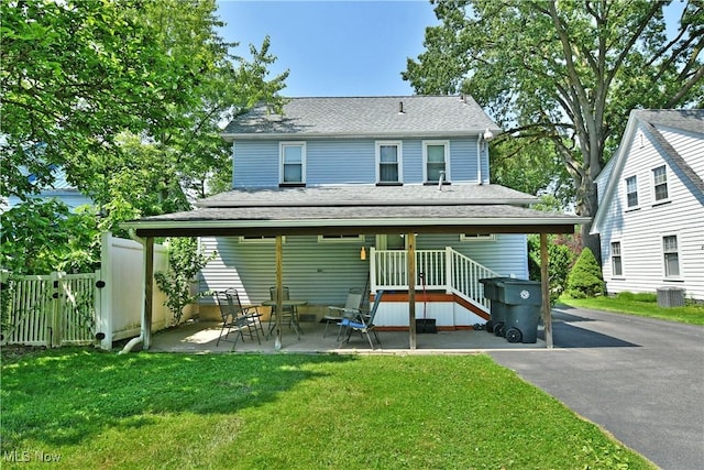 1774 Edgewood St NE, Warren, OH 44483 - back of house with a shingled roof and a patio