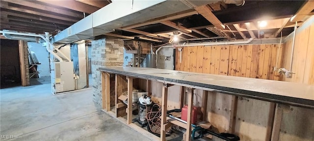 215 N 10th St, Cambridge, OH 43725 - unfinished below grade area with water heater and heating unit