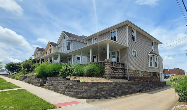 215 N 10th St, Cambridge, OH 43725 - view of front of home featuring a porch