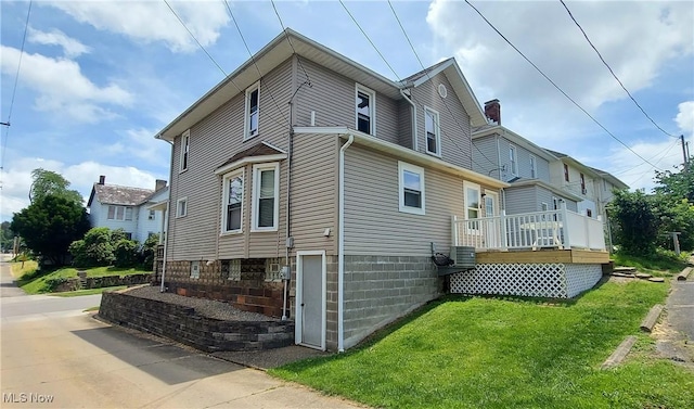215 N 10th St, Cambridge, OH 43725 - view of side of home with a lawn and a chimney