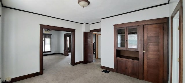 215 N 10th St, Cambridge, OH 43725 - unfurnished room featuring light colored carpet and crown molding