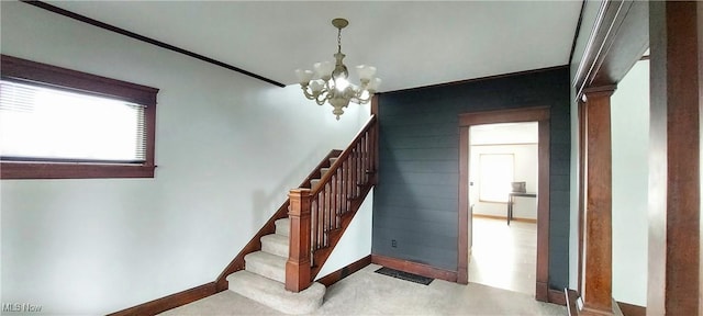 215 N 10th St, Cambridge, OH 43725 - staircase with a chandelier and baseboards