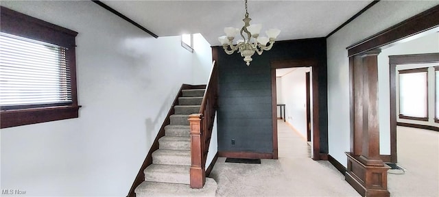 215 N 10th St, Cambridge, OH 43725 - stairway featuring a chandelier, ornate columns, and carpet flooring