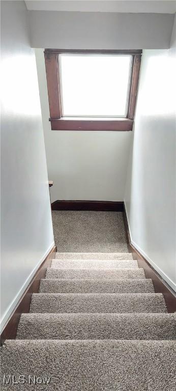 215 N 10th St, Cambridge, OH 43725 - staircase with baseboards