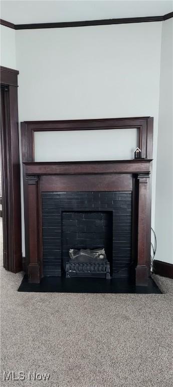 215 N 10th St, Cambridge, OH 43725 - detailed view of a fireplace with flush hearth and ornamental molding