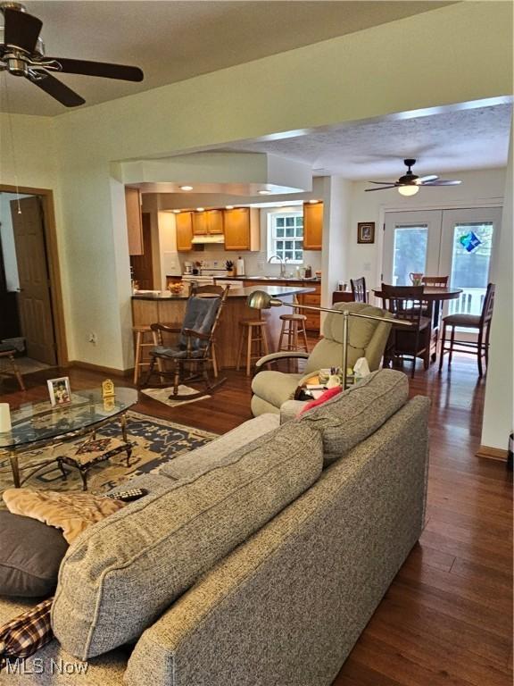 3925 N Wedgewood Dr, Mcconnelsville, OH 43756 - living area featuring a ceiling fan, dark wood finished floors, and healthy amount of natural light