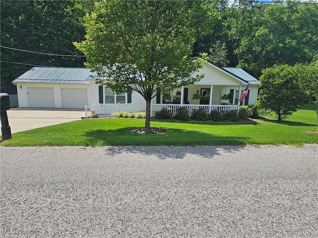 3925 N Wedgewood Dr, Mcconnelsville, OH 43756 - ranch-style home featuring covered porch, a garage, a metal roof, and a front yard