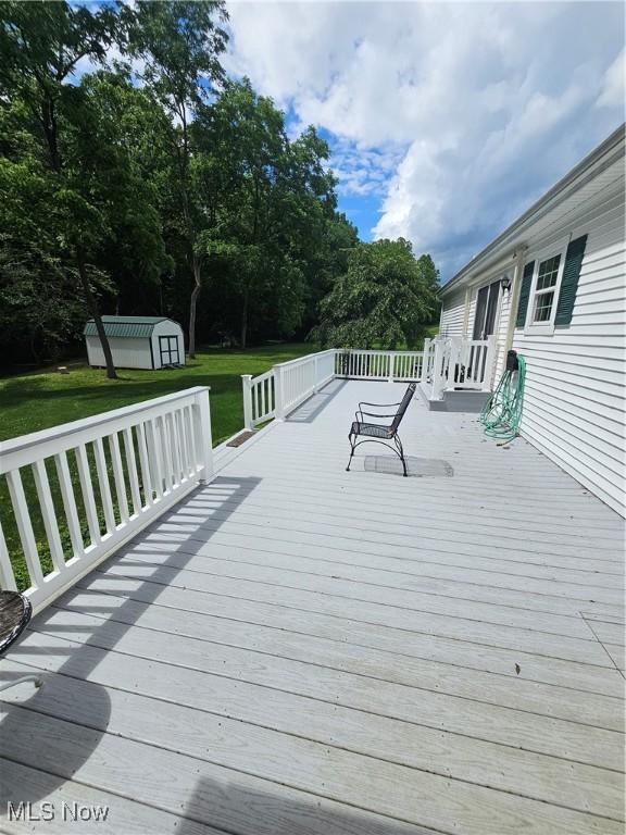 3925 N Wedgewood Dr, Mcconnelsville, OH 43756 - deck featuring a storage shed and a yard