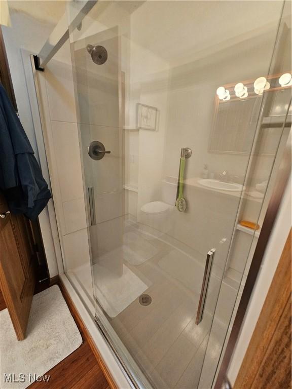 3925 N Wedgewood Dr, Mcconnelsville, OH 43756 - full bathroom featuring a shower stall and wood finished floors