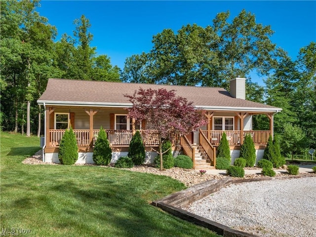 62063 Savage Rd, Cambridge, OH 43725 - view of front facade with a porch, a chimney, a front yard, and a shingled roof