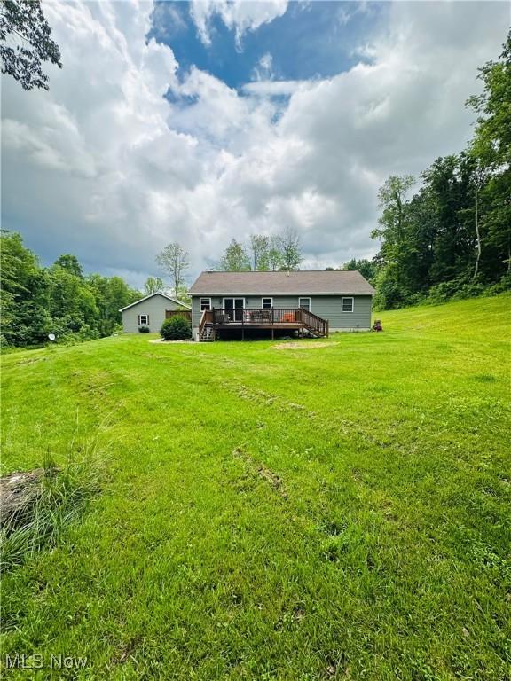 62063 Savage Rd, Cambridge, OH 43725 - back of property with a deck and a yard