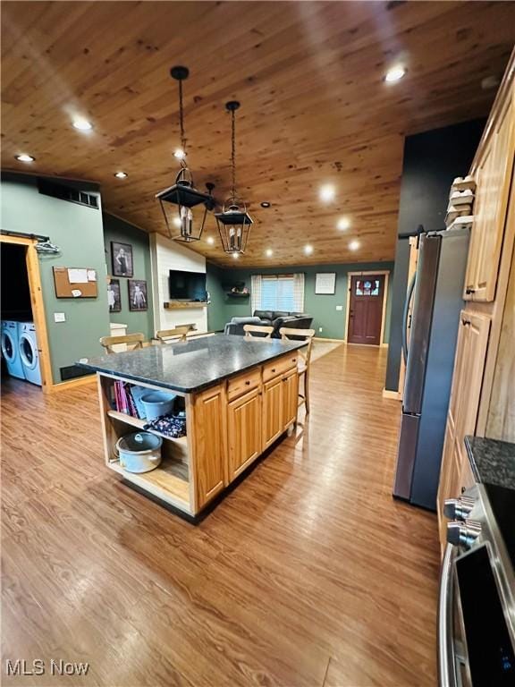 62063 Savage Rd, Cambridge, OH 43725 - kitchen with washer and clothes dryer, open shelves, freestanding refrigerator, light wood-type flooring, and wood ceiling