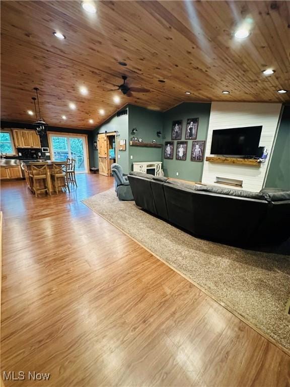 62063 Savage Rd, Cambridge, OH 43725 - reception area with a barn door, vaulted ceiling, ceiling fan, and wooden ceiling