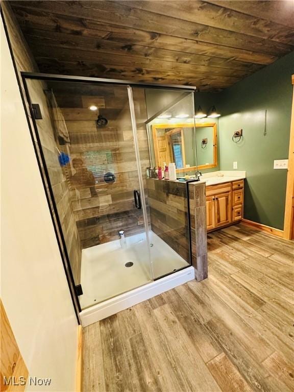 62063 Savage Rd, Cambridge, OH 43725 - bathroom featuring wood ceiling, vanity, wood finished floors, and a shower stall