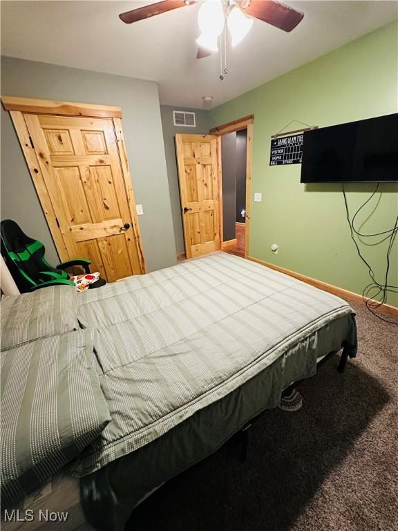 62063 Savage Rd, Cambridge, OH 43725 - carpeted bedroom featuring ceiling fan and baseboards