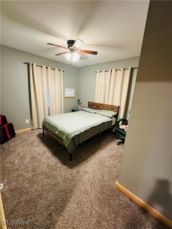 62063 Savage Rd, Cambridge, OH 43725 - carpeted bedroom featuring baseboards and a ceiling fan