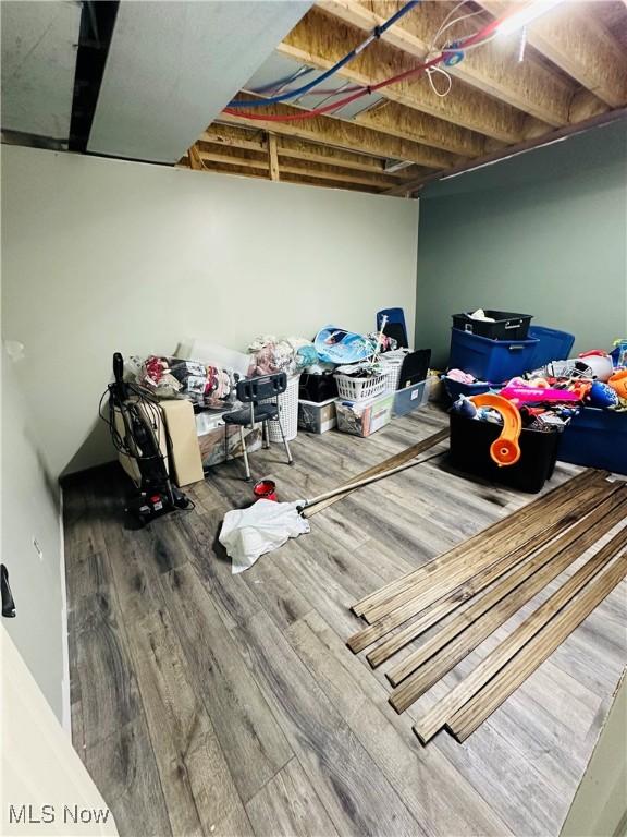 62063 Savage Rd, Cambridge, OH 43725 - finished below grade area featuring wood finished floors