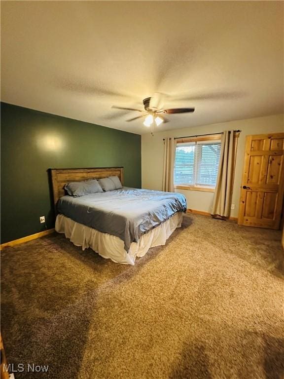 62063 Savage Rd, Cambridge, OH 43725 - carpeted bedroom with baseboards and ceiling fan